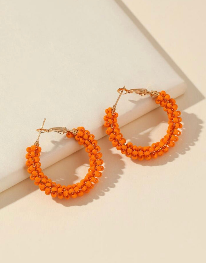 Orange beaded hoops